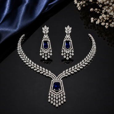 Elegant blue stone AD necklace and matching earrings set with sparkling silver-tone detailing
