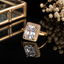 Elegant gold-tone rectangular CZ statement ring with sparkling crystal detailing and polished finish