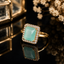 Elegant gold-tone rectangular CZ statement ring with sparkling crystal detailing and polished finish