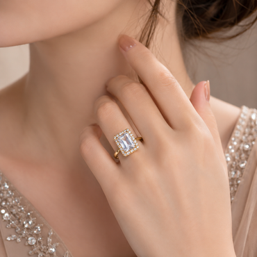 Elegant gold-tone rectangular CZ statement ring with sparkling crystal detailing and polished finish