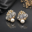 Elegant gold-tone crystal pearl statement earrings with intricate floral detailing and pearl drops