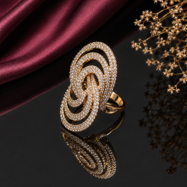 Elegant gold-tone triple loop CZ statement ring with sparkling clear stones and interlocking oval design