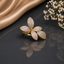 Elegant gold-tone floral CZ statement ring featuring five sparkling petals with intricate stone detailing