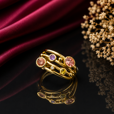Elegant gold-tone multicolor gemstone statement ring with pink purple peach and yellow round stones