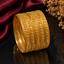 Elegant gold-tone traditional bangle set with intricate leaf pattern and textured detailing