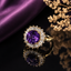Elegant purple stone CZ halo statement ring with sparkling baguette detailing and gold-tone finish
