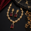 Ruby red crystal leaf link necklace and matching earrings set with gold-tone finish