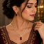 Ruby red crystal leaf link necklace and matching earrings set with gold-tone finish