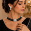 Elegant silver-tone pearl and crystal bridal necklace set with matching earrings and floral centerpiece