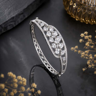 Elegant silver-tone CZ crystal bracelet with floral-inspired design and sparkling stones