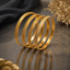 Elegant gold-tone textured slim bangle set with delicate detailing and classic finish