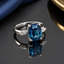 Blue Cushion-Cut Statement Ring with Marquise Accents