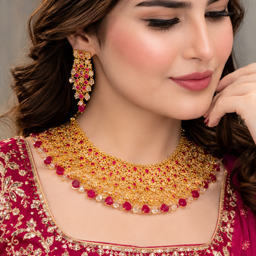 Ruby red American Diamond bridal choker set with matching earrings and maang tikka in golden finish