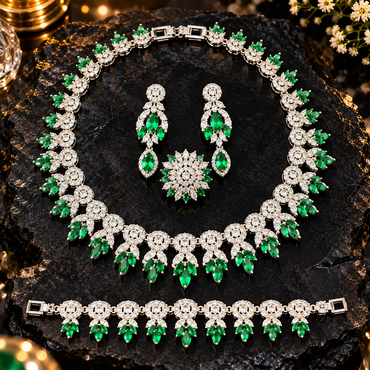 Emerald-green and silver-tone floral jewellery set with a necklace, drop earrings, bracelet and floral ring, decorated with clear sparkling accents.