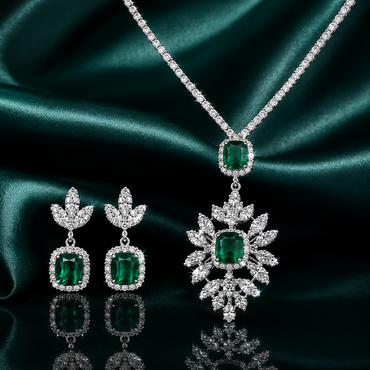 Emerald green CZ floral pendant necklace and drop earrings set in silver-tone finish with cushion-cut green cubic zirconia and white CZ accents