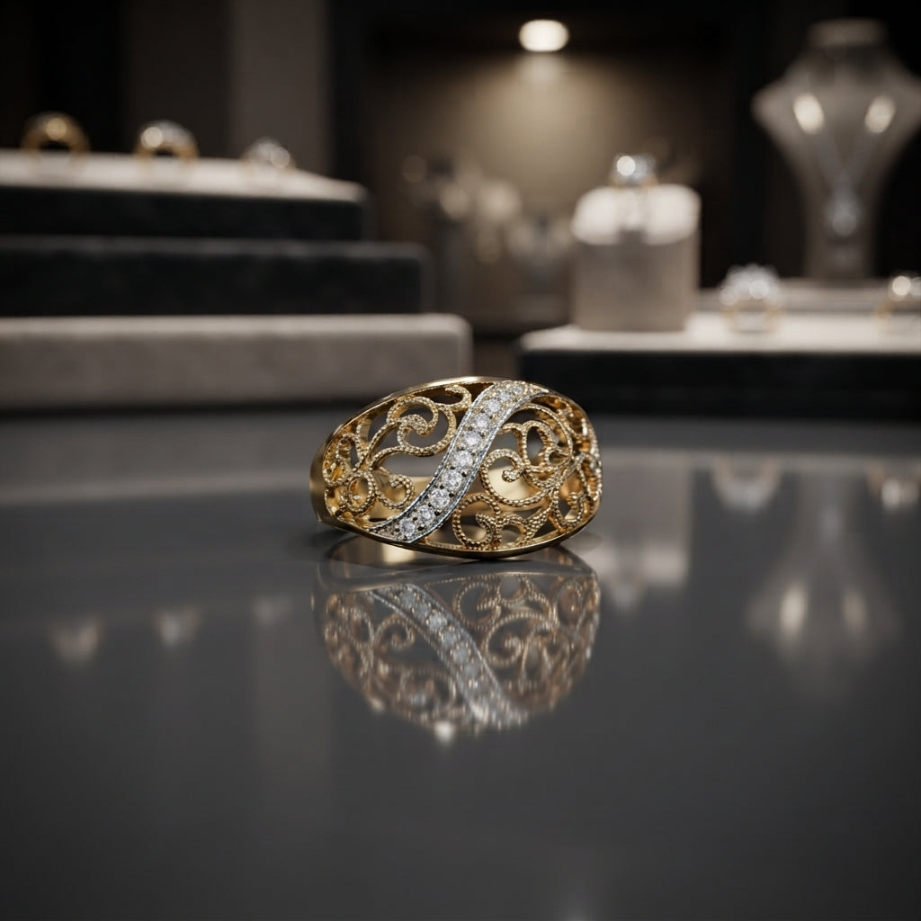 Gold-tone CZ pavé diagonal bar filigree scroll dome ring on reflective grey surface