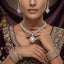Silver-Tone Princess Cut CZ Diamond-Shape Pavé Halo Pendant Necklace & Drop Earrings Bridal Set worn by South Asian bridal model in purple velvet embroidered lehenga with gold brass vase backdrop