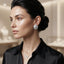 Model wearing round silver-tone cubic zirconia stud earrings with a sunburst halo design.