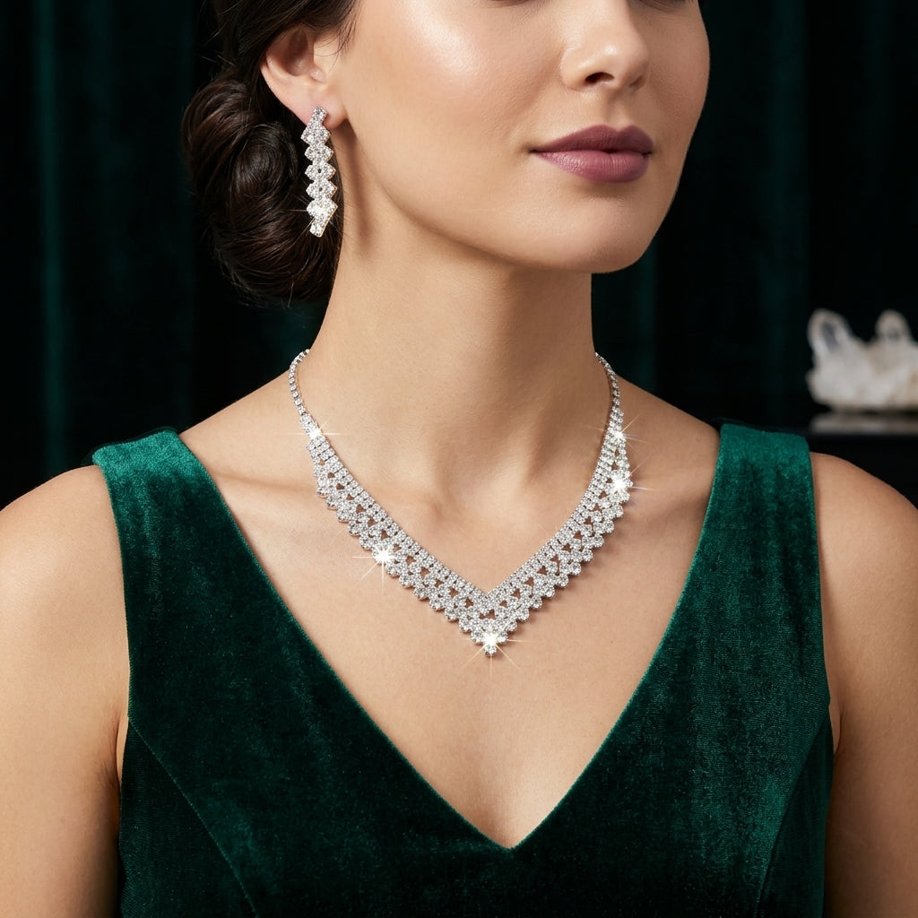 Silver-Tone Pavé White CZ V-Bib Choker Necklace & Zigzag Drop Earrings Bridal Jewelry Set worn on South Asian female model in emerald green velvet dress with dark green velvet curtain backdrop
