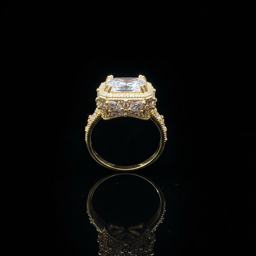 Gold ring with a large central diamond and smaller diamonds on a black background