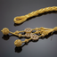 Gold jewelry with braided cord on a black background