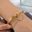 Grooved Gold Lock Charm Bracelet