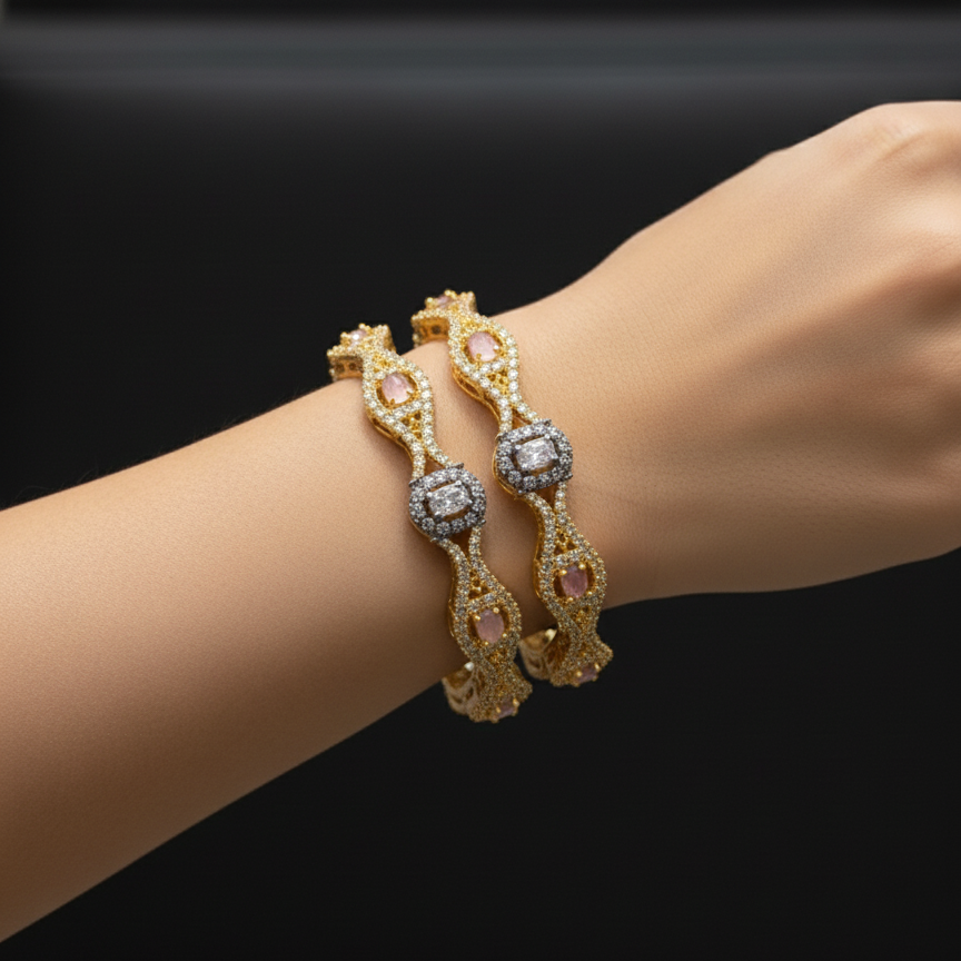 Gold bracelet with gemstones on a wrist against a black background