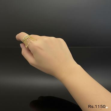 Golden statement ring with crystals and dangling design, price Rs. 1150 (per piece)