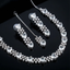 Jewelry set with necklace, bracelet, and earrings on a black background