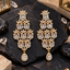 Pair of gold-tone tiered chandelier earrings with rectangular clear centre accents, halo borders, marquise-shaped flower motifs and teardrop bottom drops.