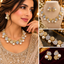 Two-tone American Diamond necklace and matching earrings with gold-tone and silver-tone sparkling motifs and white pearl-style drops