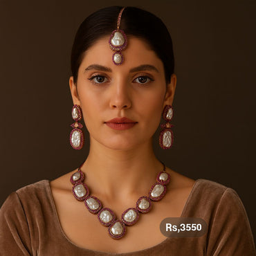 Gold-tone pearl & ruby bridal necklace set with earrings and tikka on model – Destiny.pk