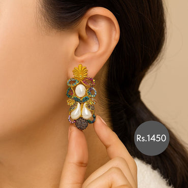 Gold-tone multicolor stone dangler earrings with pearls on model – Destiny.pk