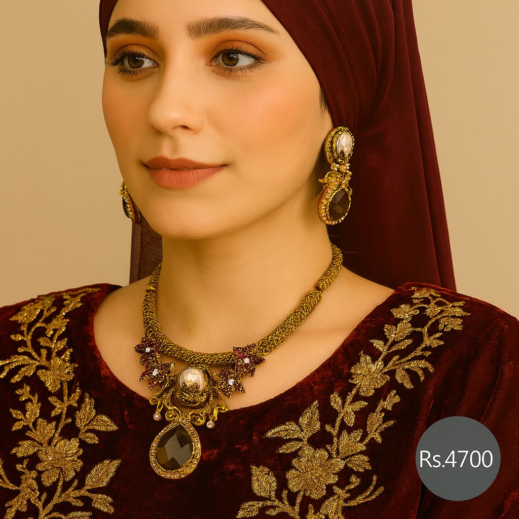 Antique gold black stone necklace set with pearl accents and matching earrings on model – Destiny.pk