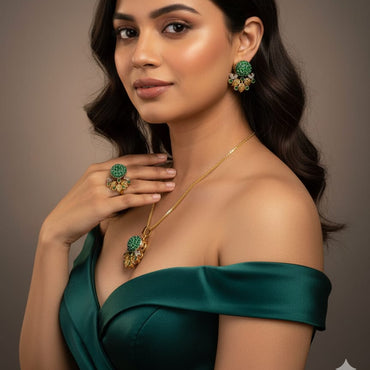 Woman wearing green jewelry against a neutral background