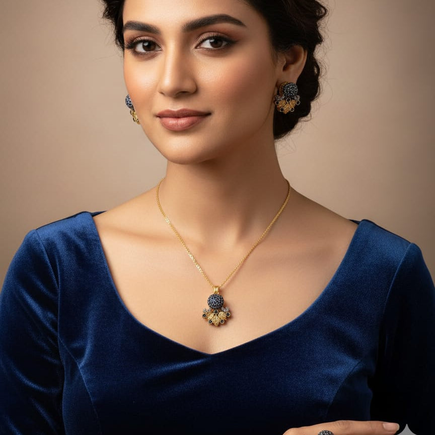 Woman wearing a blue saree with gold jewelry on a beige background