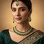 Model wearing Emerald Bridal Jewelry Set with earrings & maang tikka