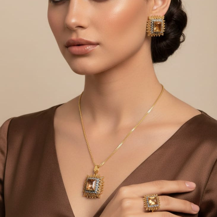 Classic gold-toned champagne stone jewelry set with necklace, earrings and ring, priced Rs. 2150