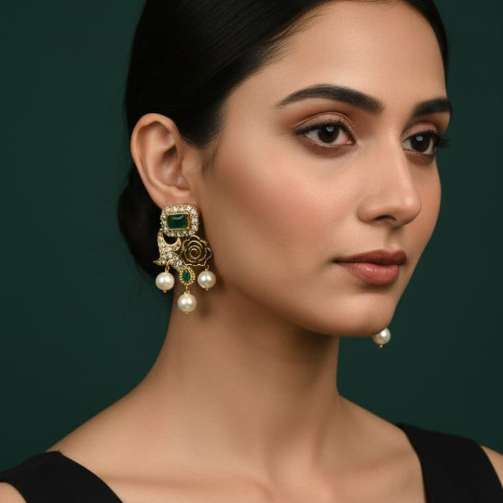Traditional gold-toned green stone pearl drop earrings, priced Rs. 1150