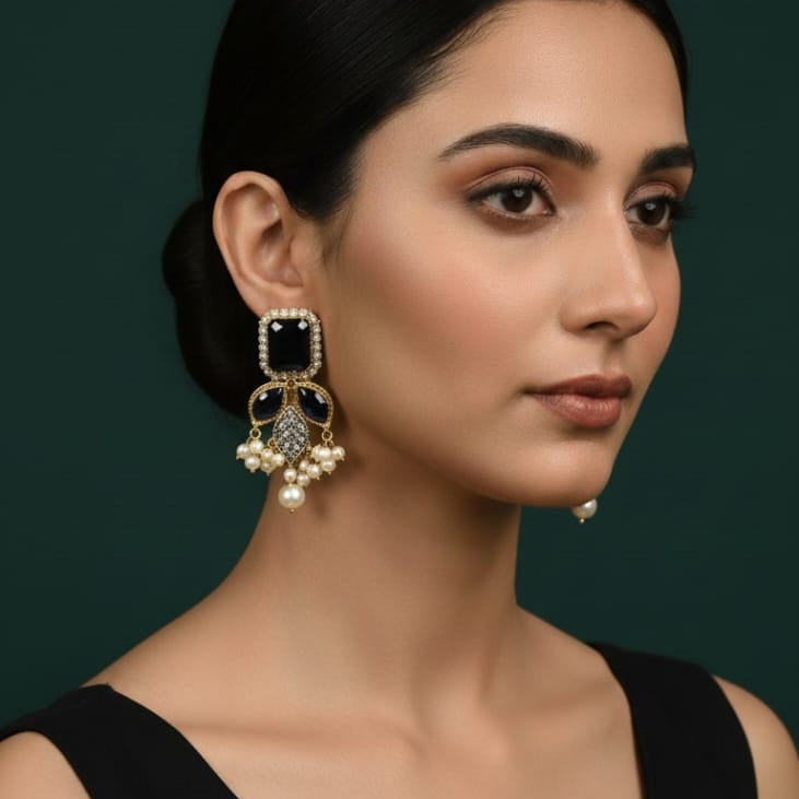 Traditional gold-toned champagne stone leaf pearl earrings, priced Rs. 1150