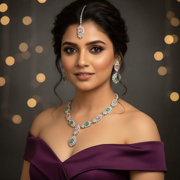 Elegant silver-toned pastel stone necklace set with matching earrings and maang tikka, priced Rs. 3450