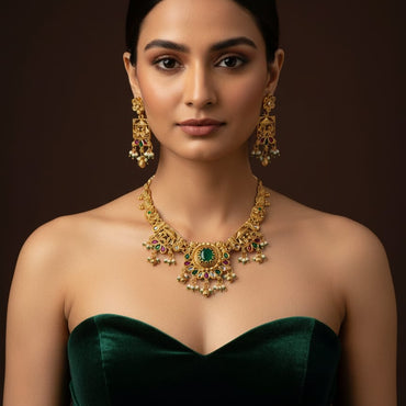 Traditional gold-plated green stone necklace set with matching earrings, priced Rs. 3950