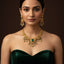 Traditional gold-plated green stone necklace set with matching earrings, priced Rs. 3950