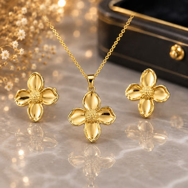 Golden four-petal floral necklace with matching earrings