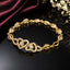 Golden heart link bracelet with sparkling crystal centerpiece