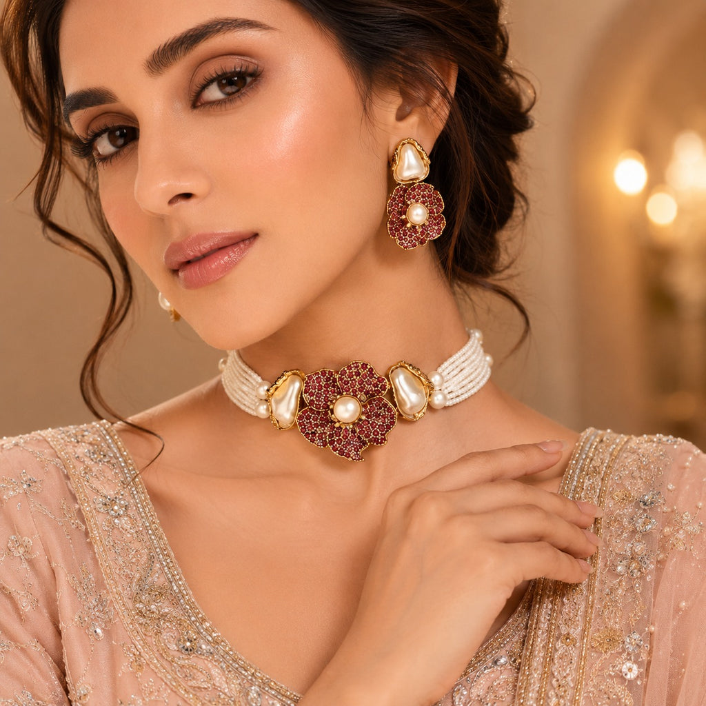 Royal layered pearl necklace with ruby-red floral centerpiece and matching earrings