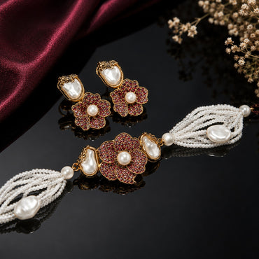 Royal layered pearl necklace with ruby-red floral centerpiece and matching earrings
