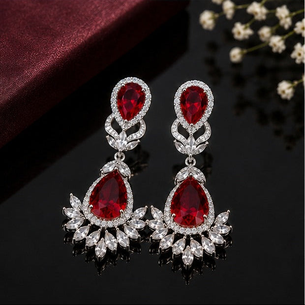 Elegant teardrop American diamond earrings with intricate floral detailing