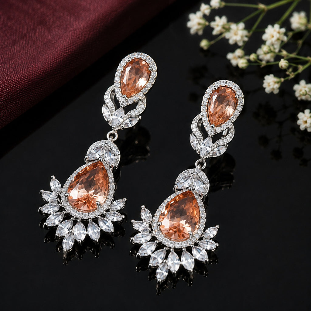 Elegant teardrop American diamond earrings with intricate floral detailing