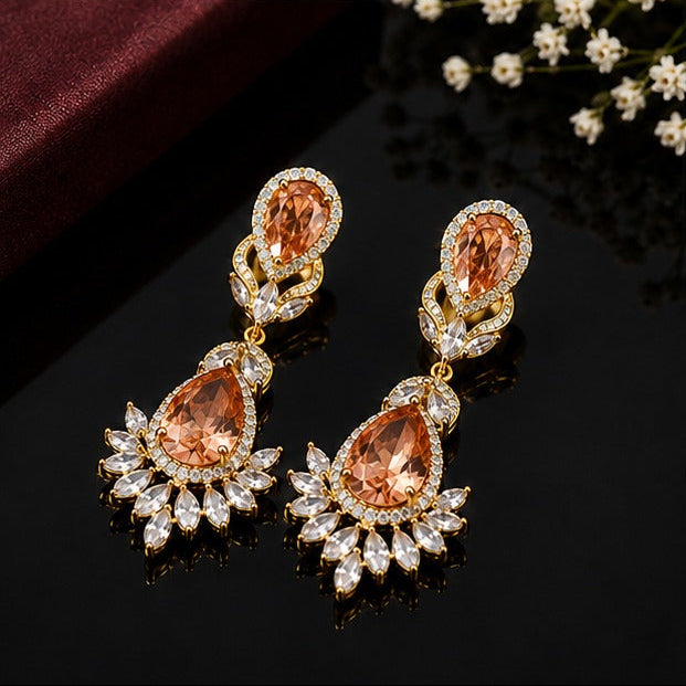 Elegant teardrop American diamond earrings with intricate floral detailing